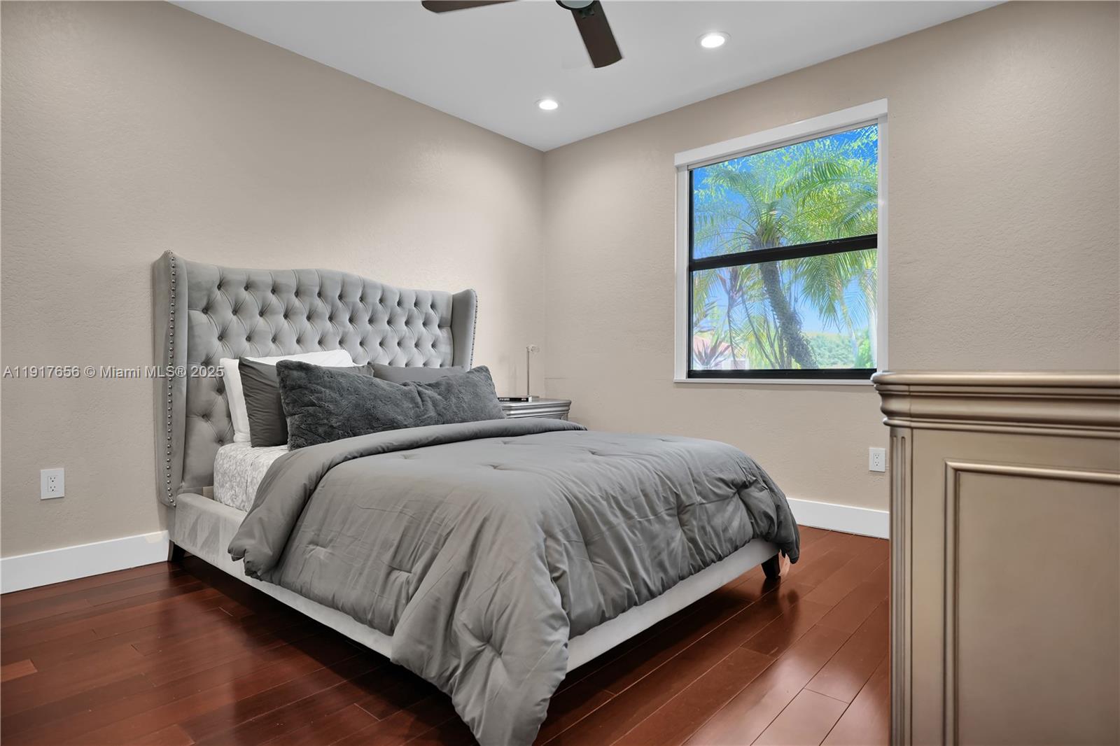 14896 Southwest 38th Street Davie, FL 33331 - Photo 30 of 60 a bedroom with a bed and window