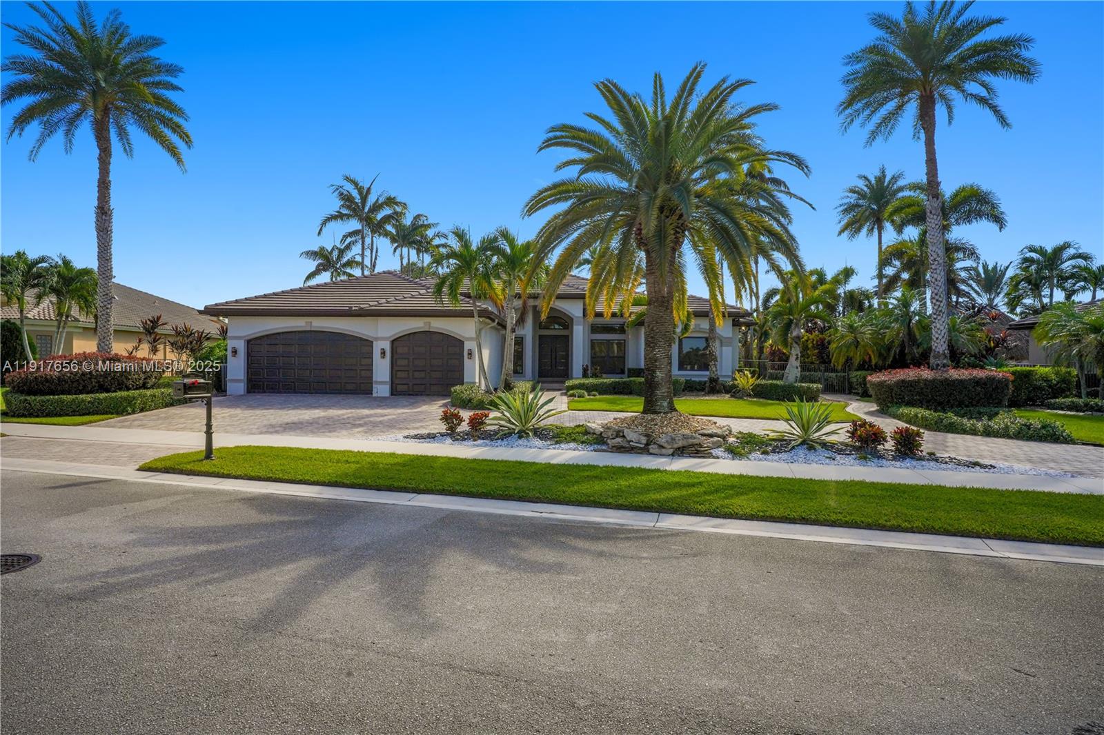 14896 Southwest 38th Street Davie, FL 33331 - Photo 3 of 60 a front view of multi story residential apartment building with yard and green space