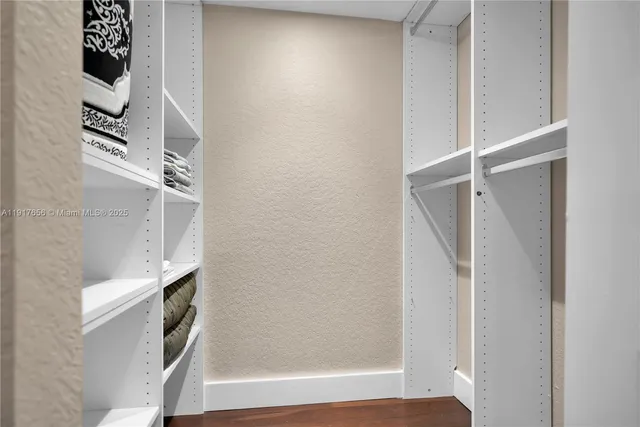 a view of a bedroom from a hallway