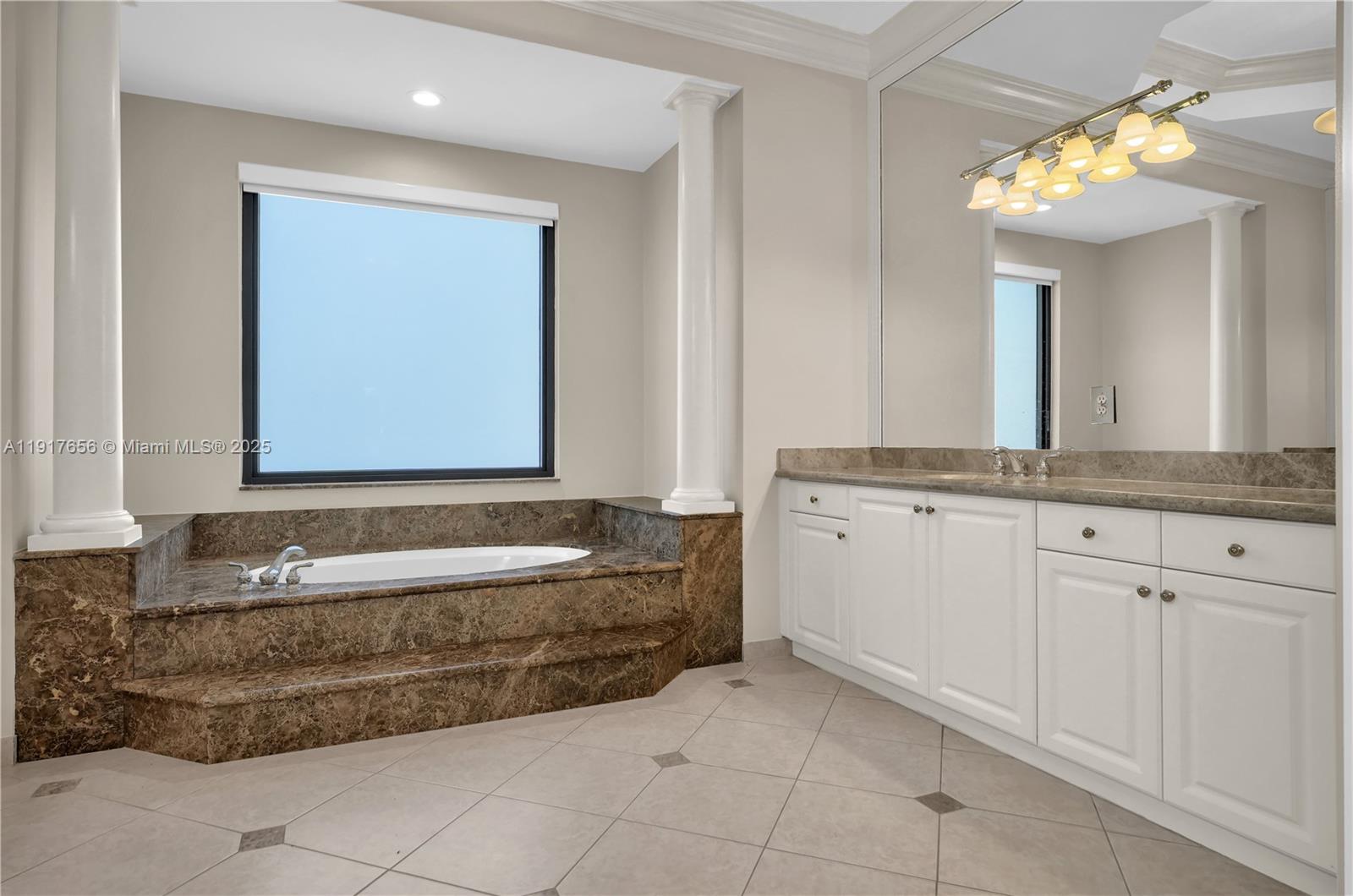 14896 Southwest 38th Street Davie, FL 33331 - Photo 37 of 60 a bathroom with a granite countertop sink and a mirror
