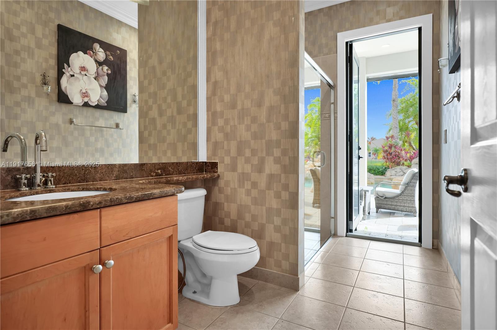 14896 Southwest 38th Street Davie, FL 33331 - Photo 40 of 60 a bathroom with a toilet sink and mirror