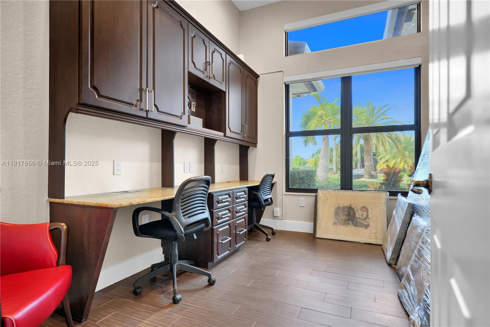 14896 Southwest 38th Street Davie, FL 33331 - Photo 45 of 60 a living room with furniture a flat screen tv and windows