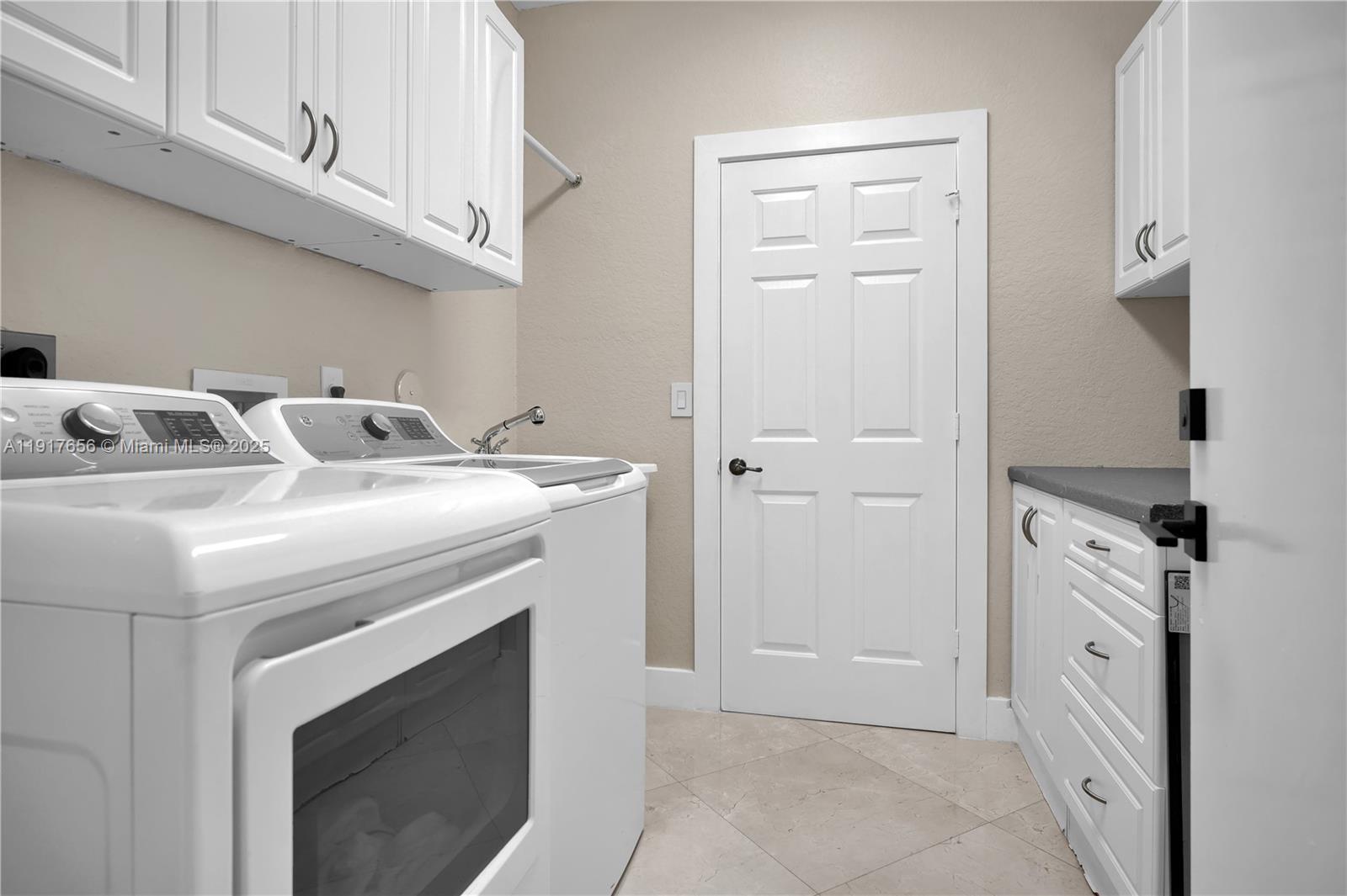 14896 Southwest 38th Street Davie, FL 33331 - Photo 46 of 60 a utility room with dryer and washer