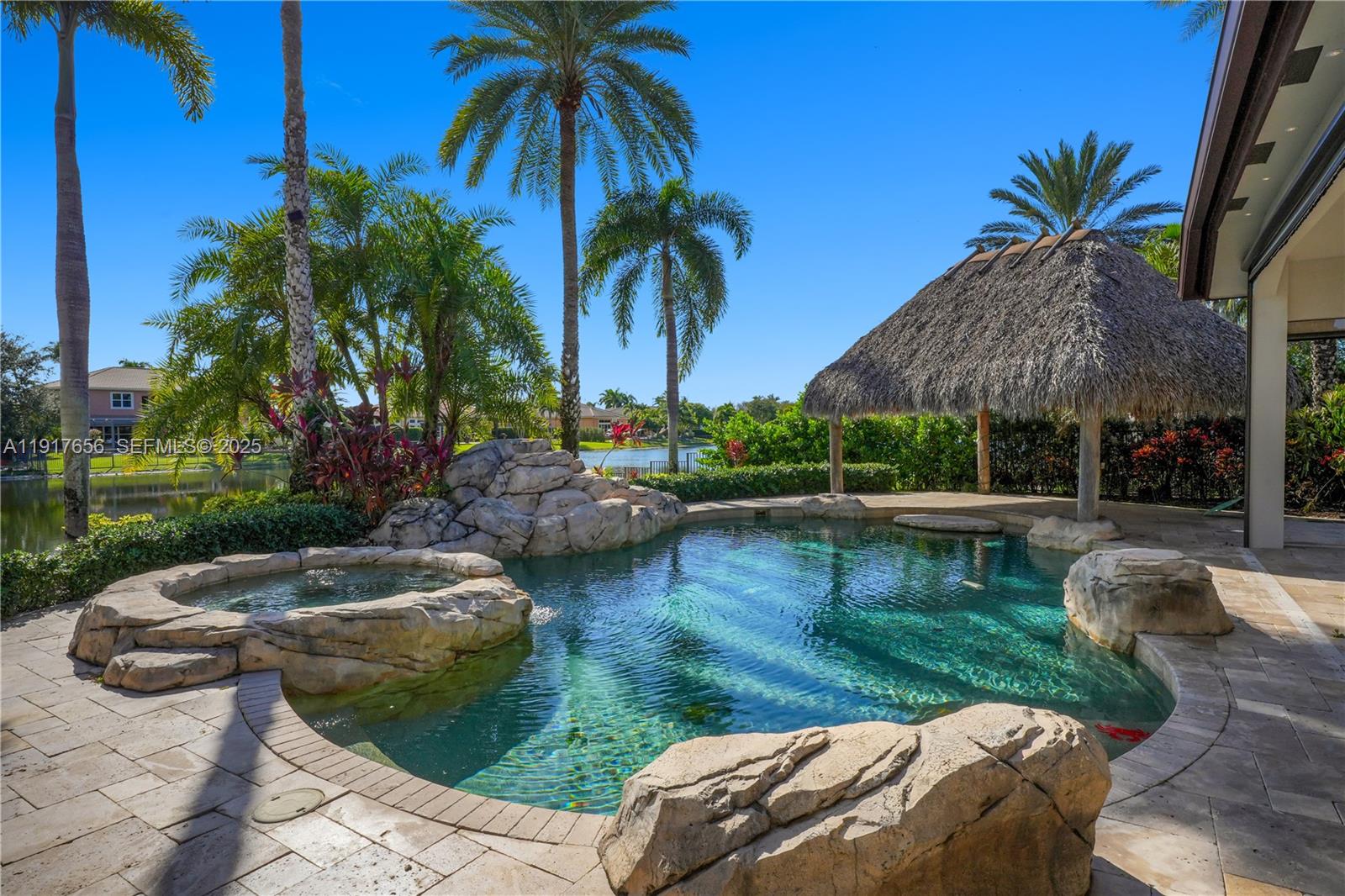 14896 Southwest 38th Street Davie, FL 33331 - Photo 48 of 60 a view of swimming pool and lake view