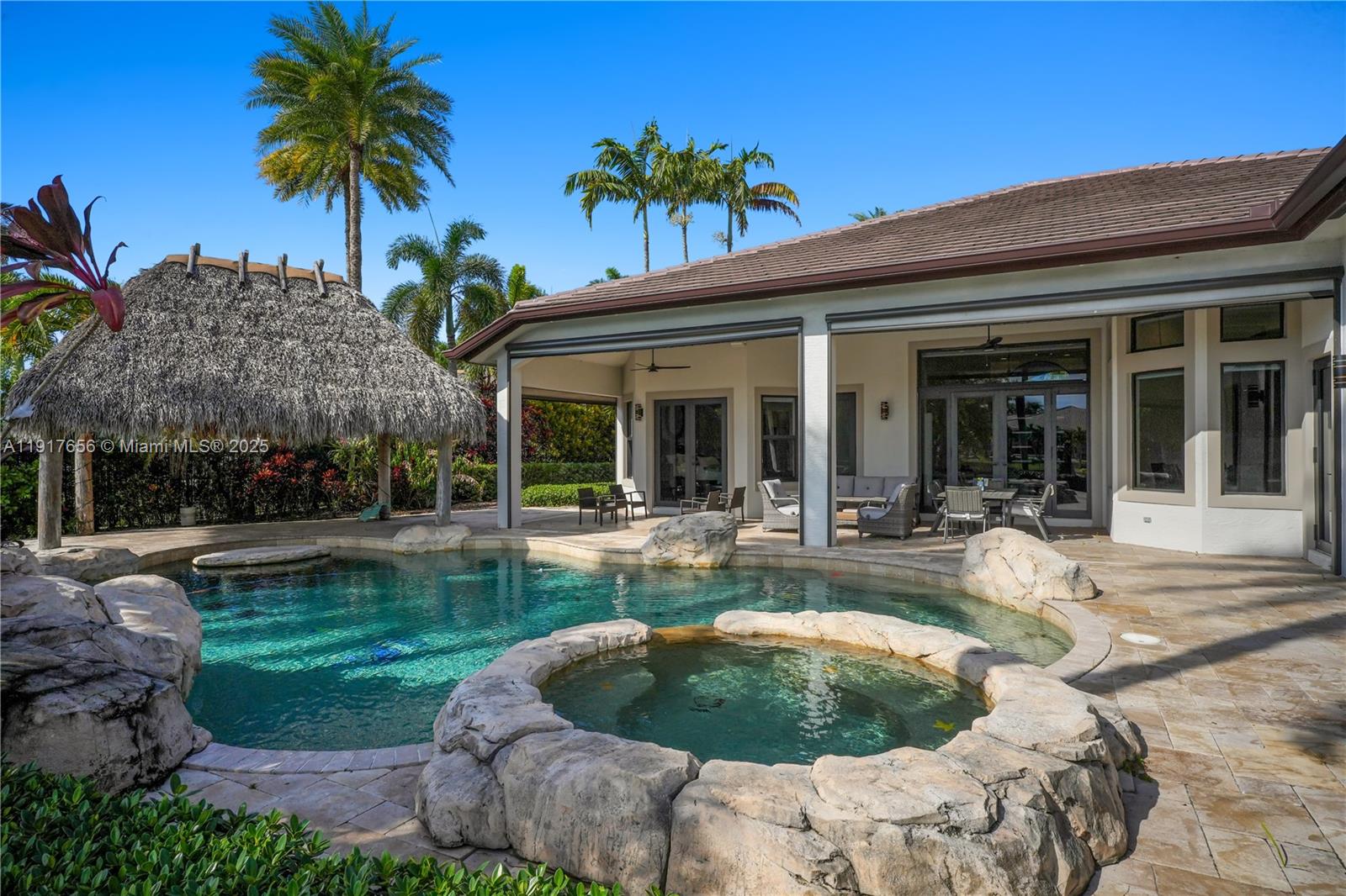 14896 Southwest 38th Street Davie, FL 33331 - Photo 50 of 60 a view of a house with backyard swimming pool and sitting area