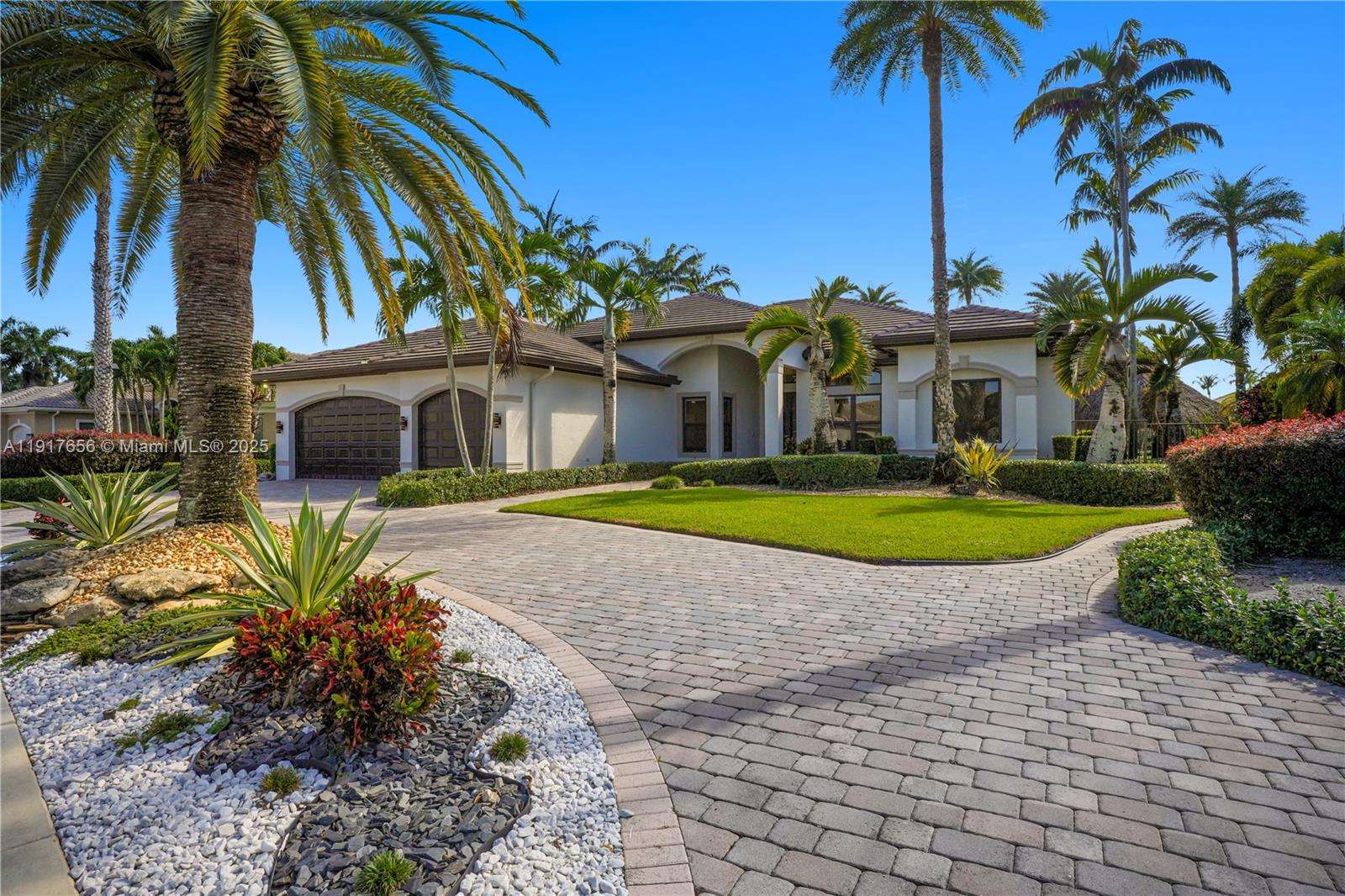 14896 Southwest 38th Street Davie, FL 33331 - Photo 5 of 60 a view of a white house with a swimming pool and a lawn chair