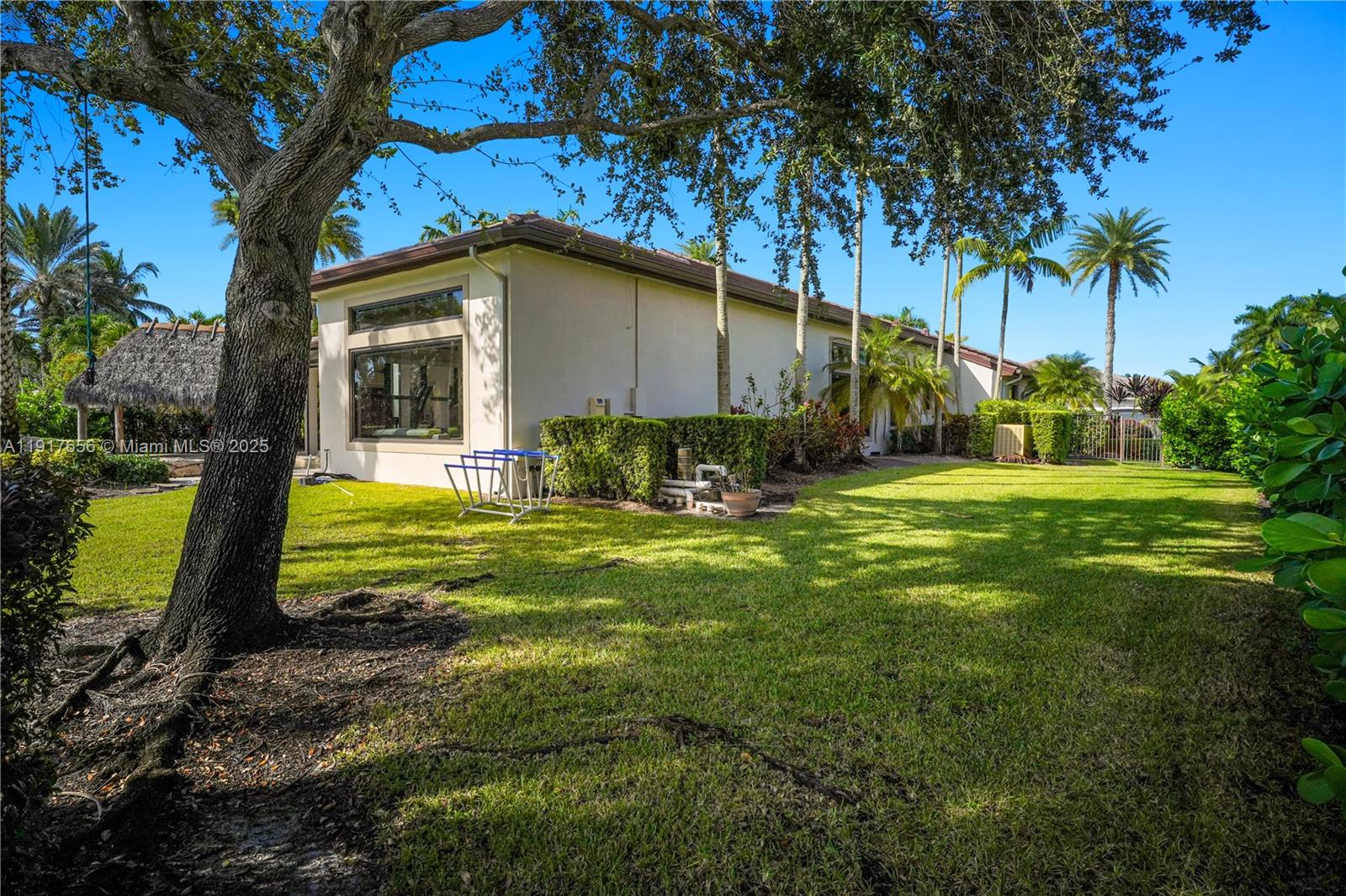 14896 Southwest 38th Street Davie, FL 33331 - Photo 56 of 60 a view of a house with backyard and sitting area