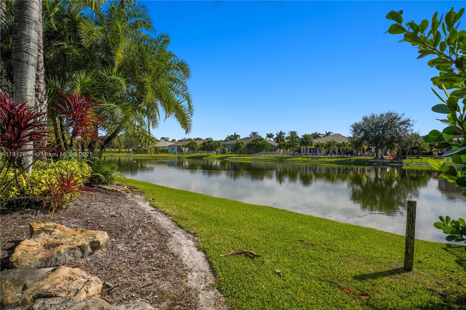 14896 Southwest 38th Street Davie, FL 33331 - Photo 57 of 60 a view of a lake with a building in the background