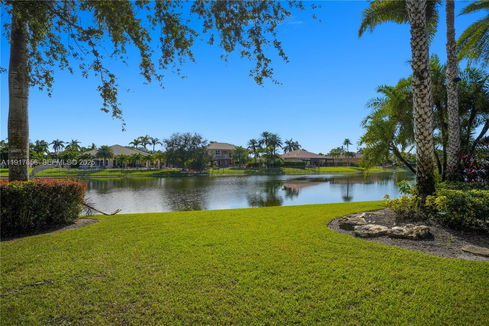 14896 Southwest 38th Street Davie, FL 33331 - Photo 58 of 60 a view of a lake with a big yard