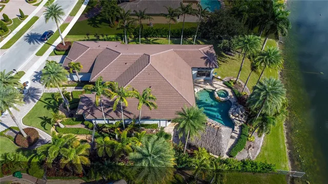 an aerial view of a house with a garden