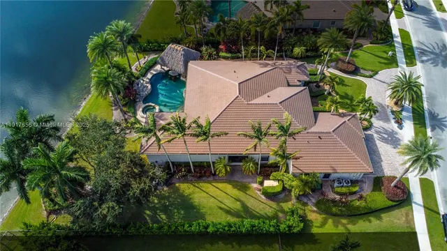 an aerial view of a house with garden space and street view