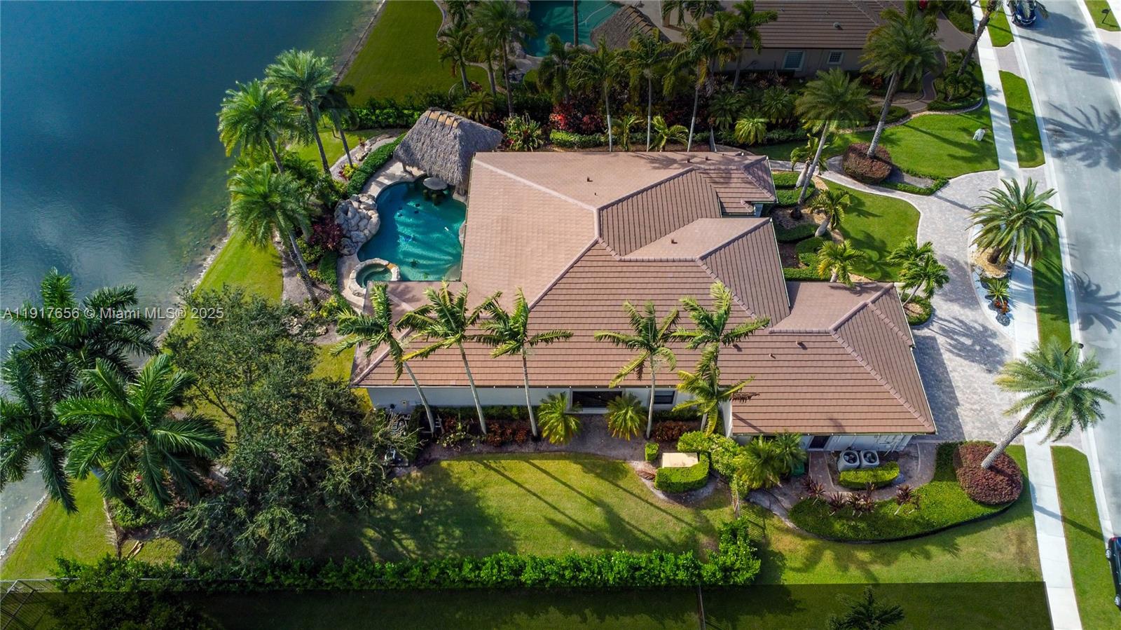 14896 Southwest 38th Street Davie, FL 33331 - Photo 9 of 60 an aerial view of a house with garden space and street view