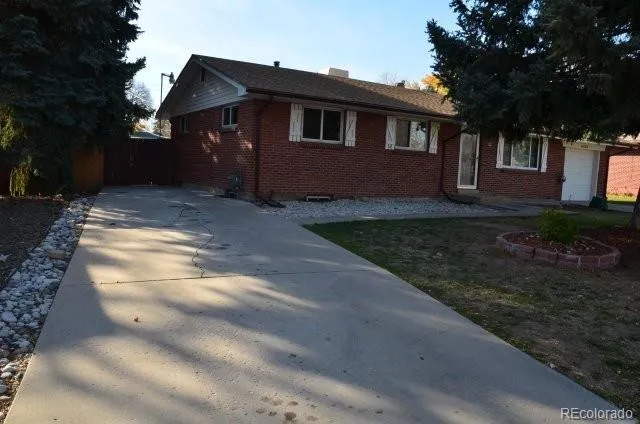 a view of house with yard