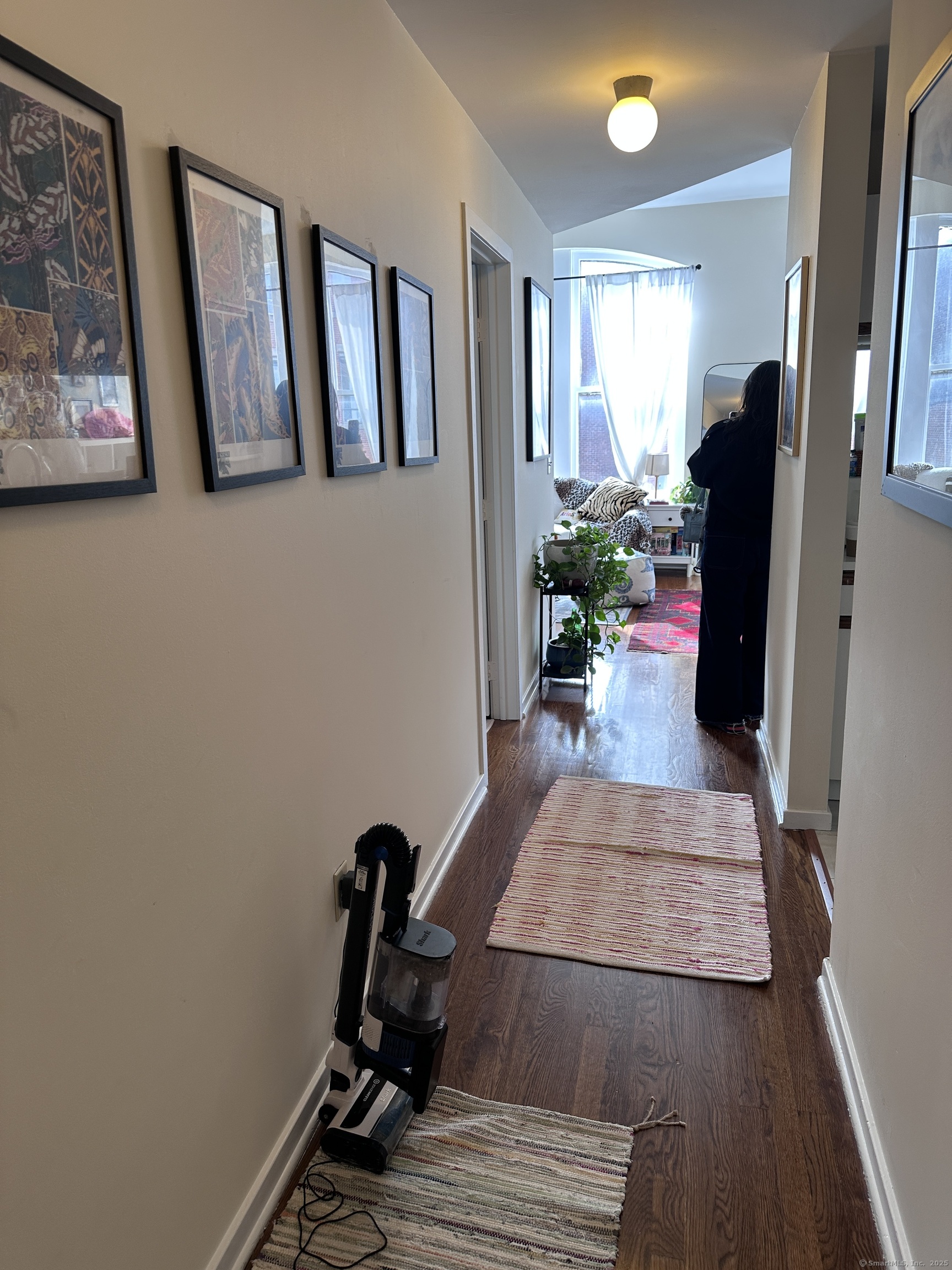 83 Washington Street, Unit 3B Norwalk, CT 06854 - Photo 4 of 12 a view of a hallway with furniture and a window