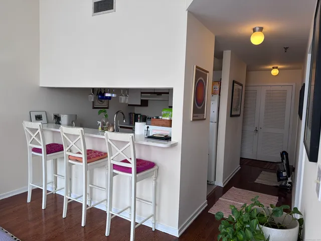 a kitchen that has a lot of cabinets and refrigerator
