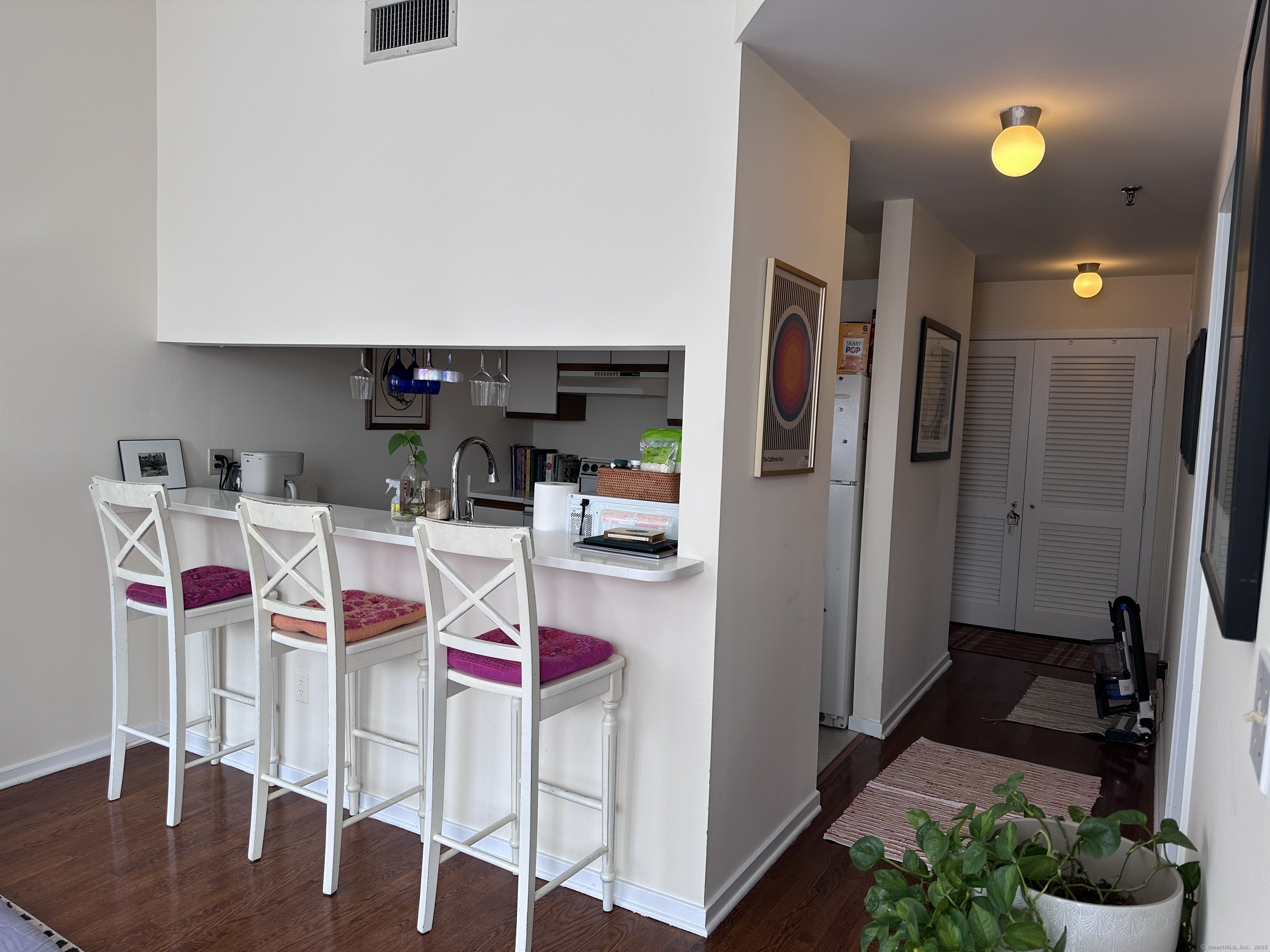 83 Washington Street, Unit 3B Norwalk, CT 06854 - Photo 6 of 12 a kitchen that has a lot of cabinets and refrigerator