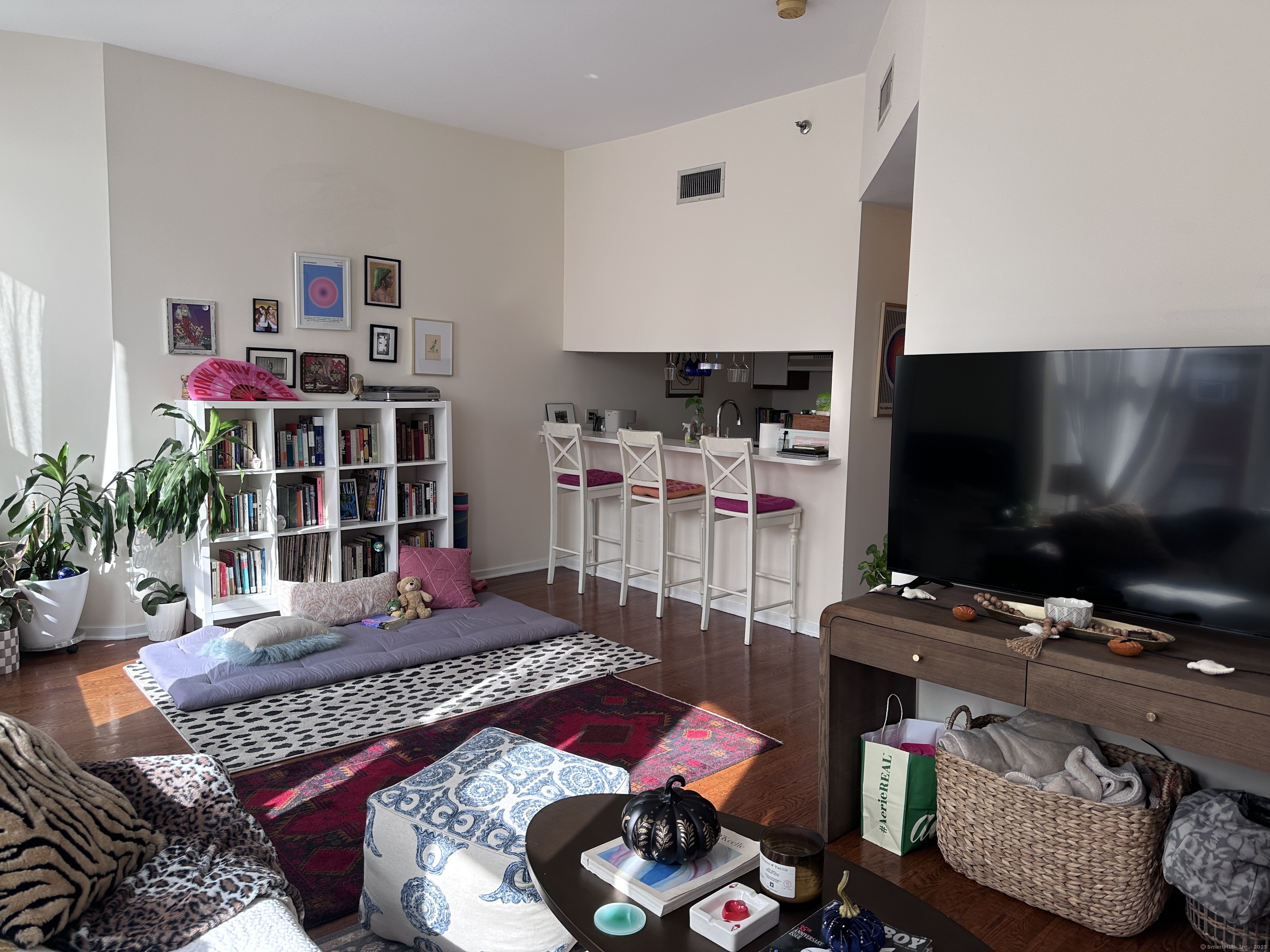 83 Washington Street, Unit 3B Norwalk, CT 06854 - Photo 7 of 12 a living room with furniture and a flat screen tv