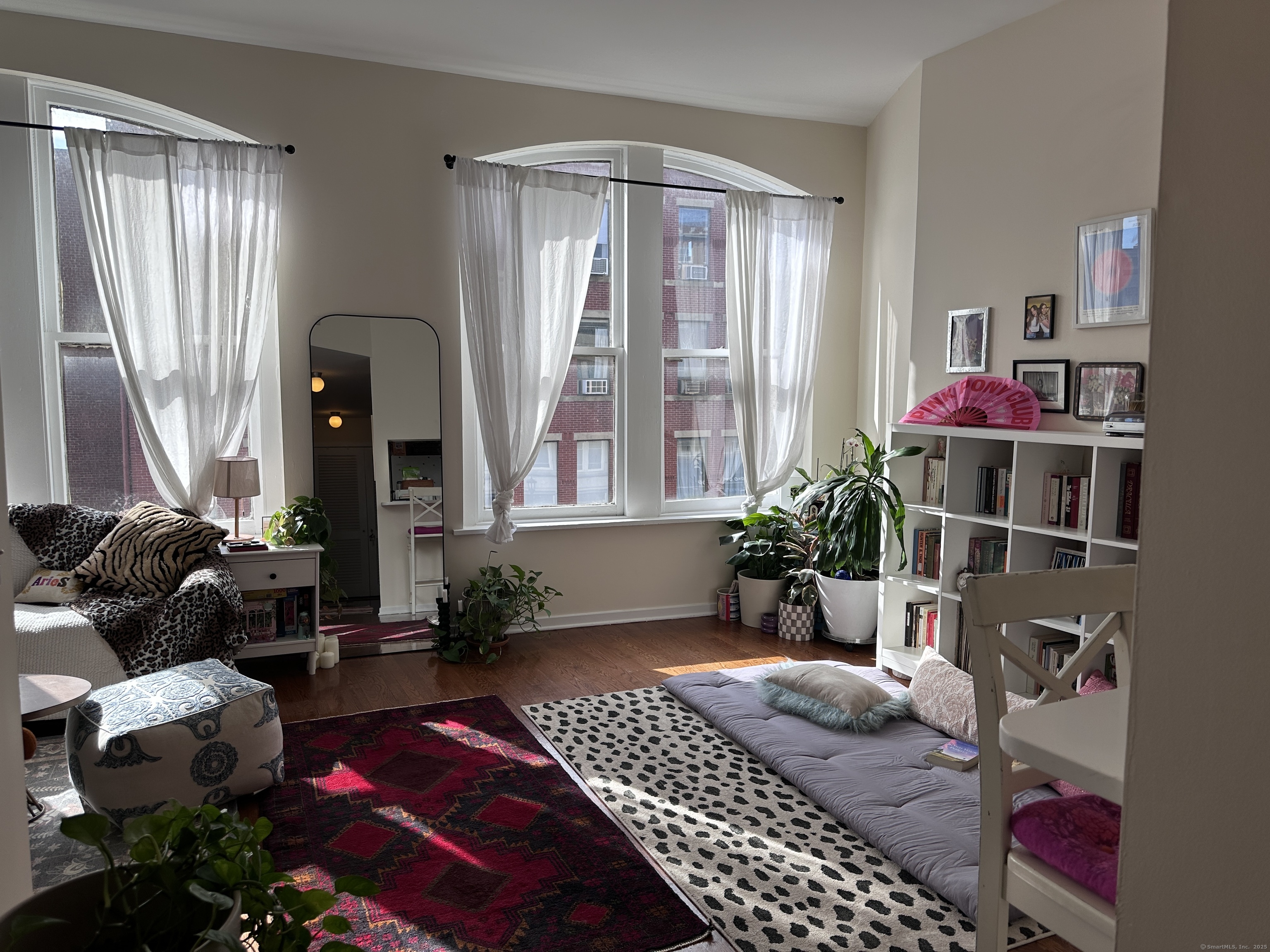 83 Washington Street, Unit 3B Norwalk, CT 06854 - Photo 10 of 12 a bedroom with a bed and a potted plant