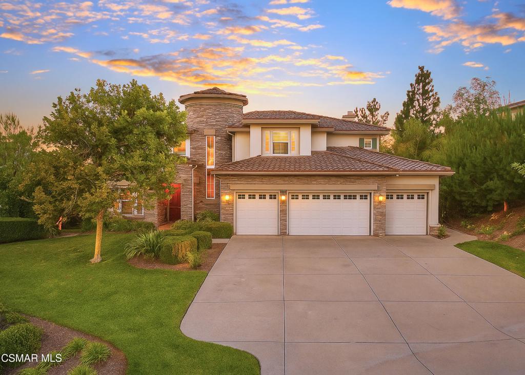 12364 Palmer Drive Moorpark, CA 93021 - Photo 1 of 31 a front view of a house with a yard and trees