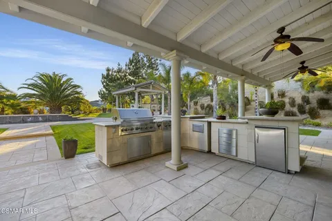 a kitchen with a stove a sink and a microwave