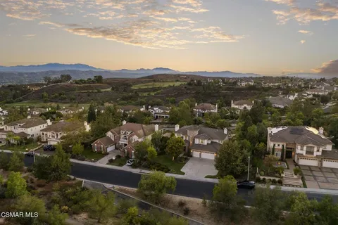 an aerial view of residential house and green space