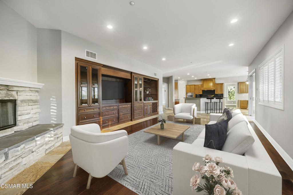 12364 Palmer Drive Moorpark, CA 93021 - Photo 8 of 31 a living room with furniture fireplace and a flat screen tv
