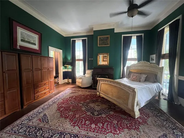 a view of a livingroom with furniture and staircase