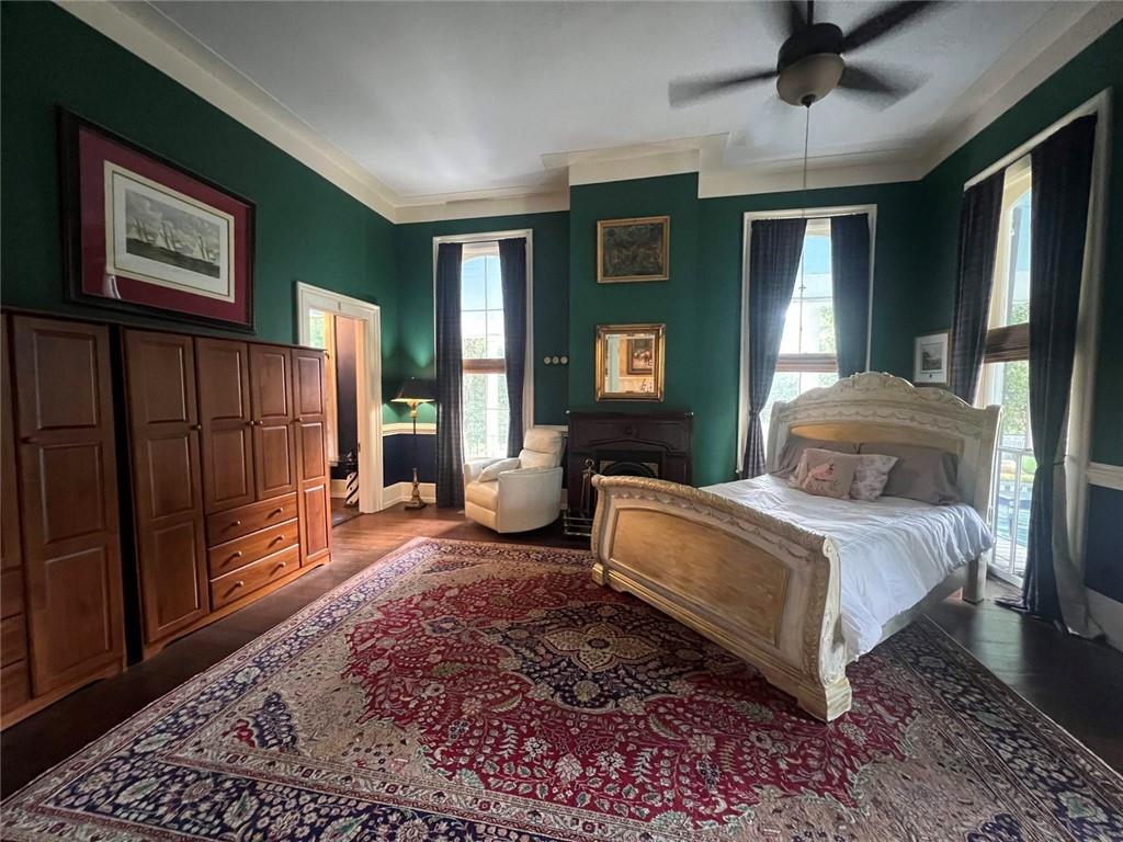 1710 Country Club Road Eufaula, AL 36027 - Photo 16 of 44 a spacious bedroom with a bed and glass door