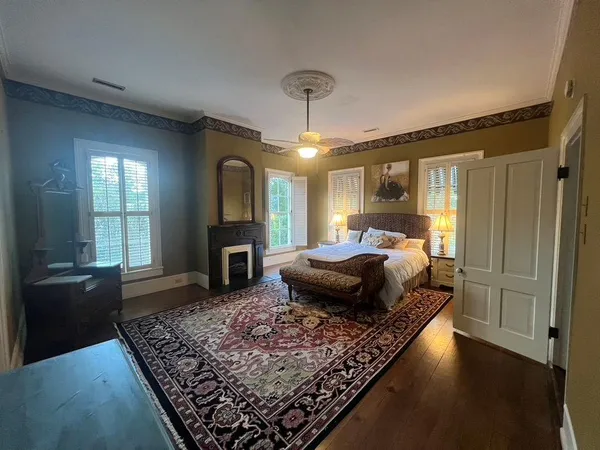 a view of entryway with window and wooden floor