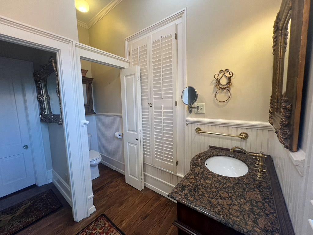 1710 Country Club Road Eufaula, AL 36027 - Photo 25 of 44 a bathroom with a granite countertop sink and a mirror