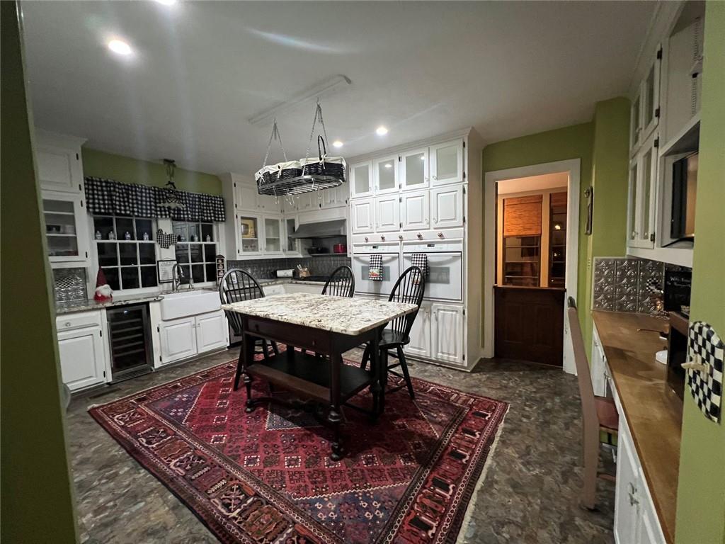 1710 Country Club Road Eufaula, AL 36027 - Photo 35 of 44 a kitchen view with a table and chairs