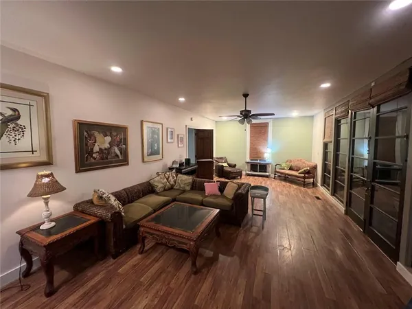 a view of a porch with furniture and garden