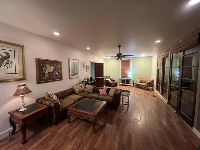 a view of a porch with furniture and garden