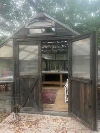 a kitchen with a sink and a large window