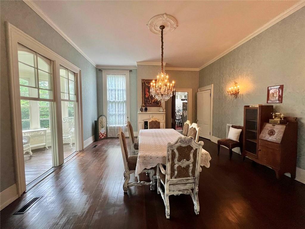 1710 Country Club Road Eufaula, AL 36027 - Photo 8 of 44 a view of a dining room with furniture window and wooden floor
