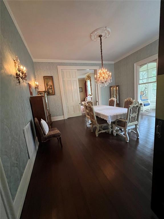 1710 Country Club Road Eufaula, AL 36027 - Photo 10 of 44 a dining room with furniture a chandelier and wooden floor