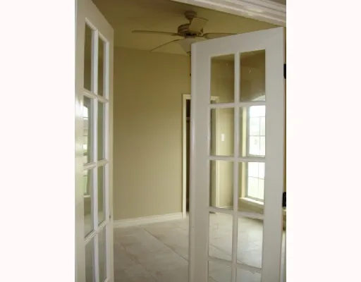 a view of an empty room with closet