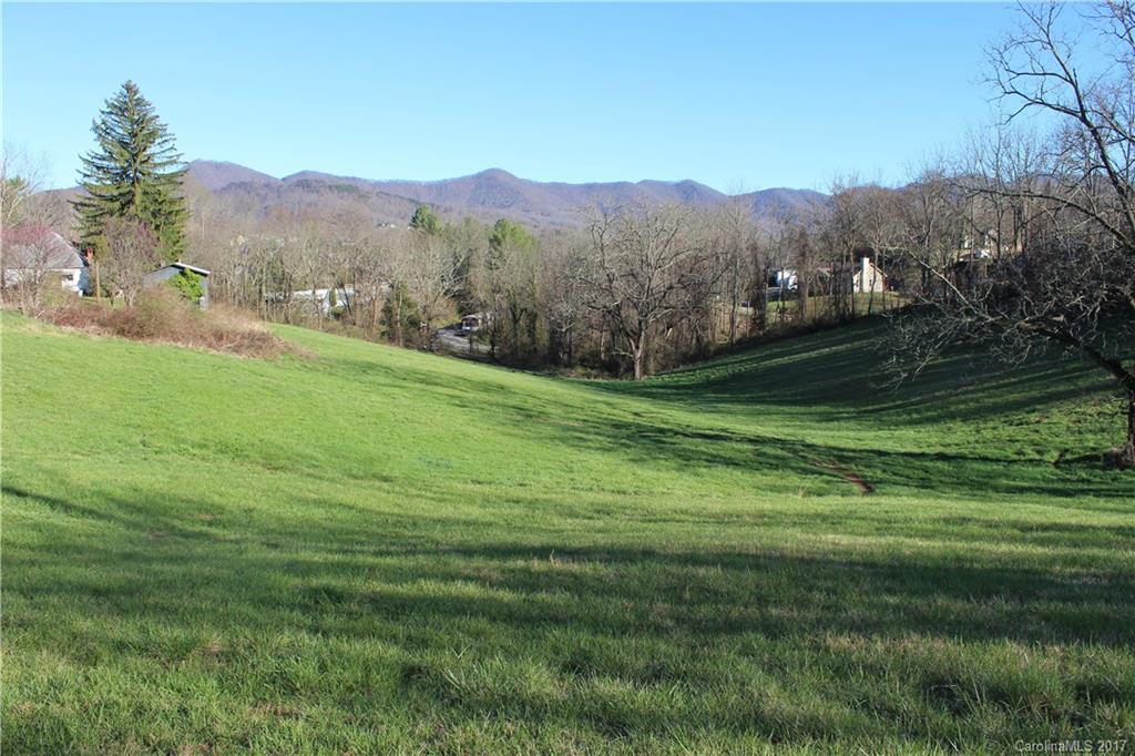 26 Star Ridge Road Canton, NC 28716 - Photo 7 of 17 a view of a lush green hillside and houses