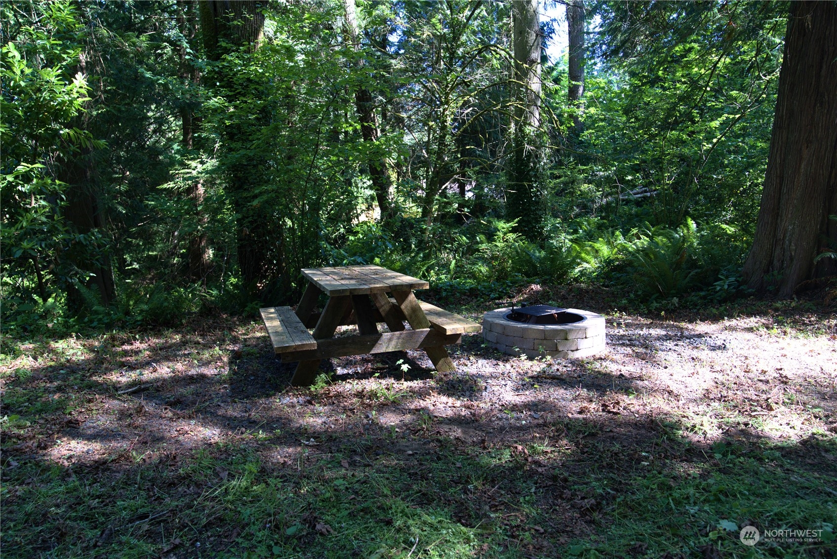 19313 Harris Avenue Northeast Suquamish, WA 98392 - Photo 4 of 6 a view of swimming pool with lawn chairs and plants