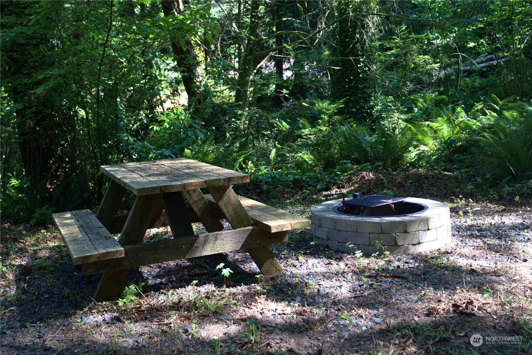 19313 Harris Avenue Northeast Suquamish, WA 98392 - Photo 5 of 6 a view of a backyard with sitting area