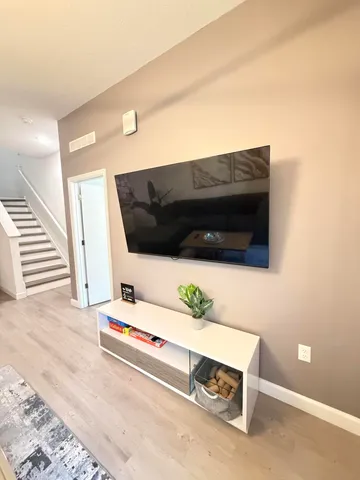 a large white bed in a white room