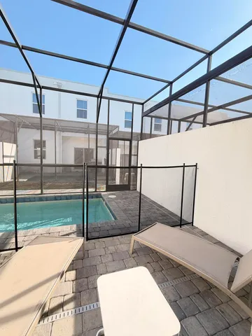 a view of swimming pool with seating area