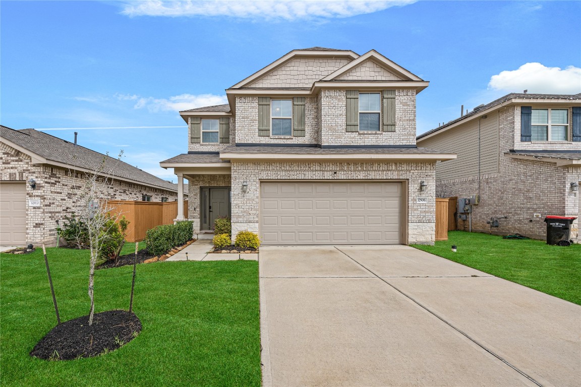 32906 Ruthie Dean Drive Brookshire, TX 77423 - Photo 1 of 23 a front view of a house with a yard and trees