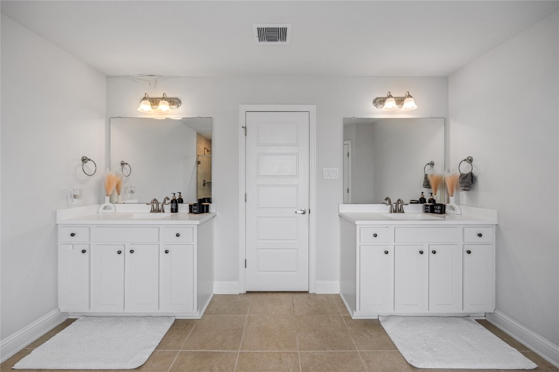 32906 Ruthie Dean Drive Brookshire, TX 77423 - Photo 18 of 23 a spacious bathroom with a sink and a mirror