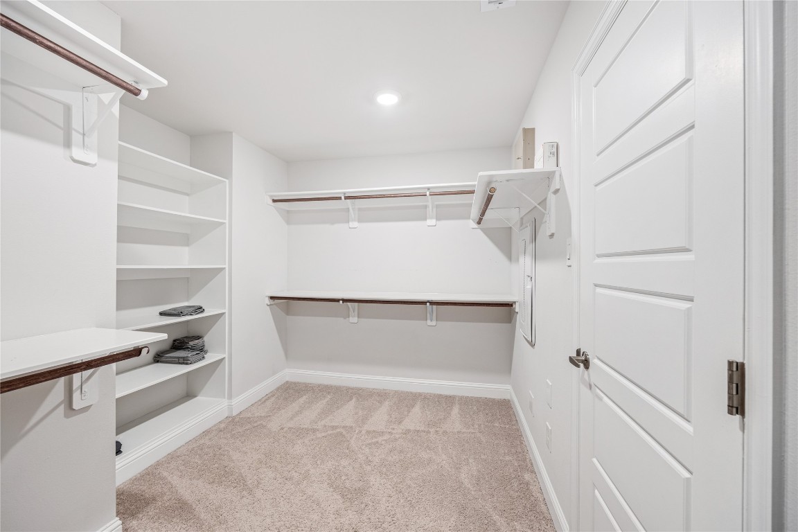 32906 Ruthie Dean Drive Brookshire, TX 77423 - Photo 20 of 23 a view of walk in closet with empty racks