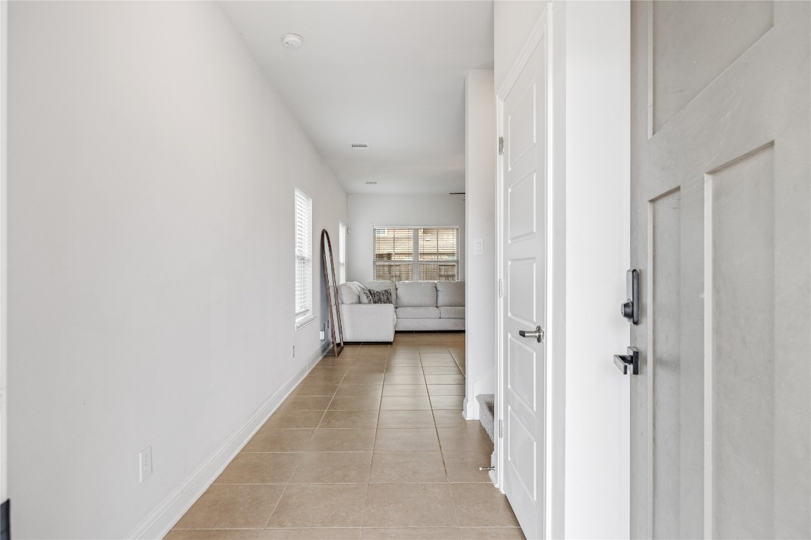 32906 Ruthie Dean Drive Brookshire, TX 77423 - Photo 3 of 23 a view of a hallway with wooden floor and a bathroom
