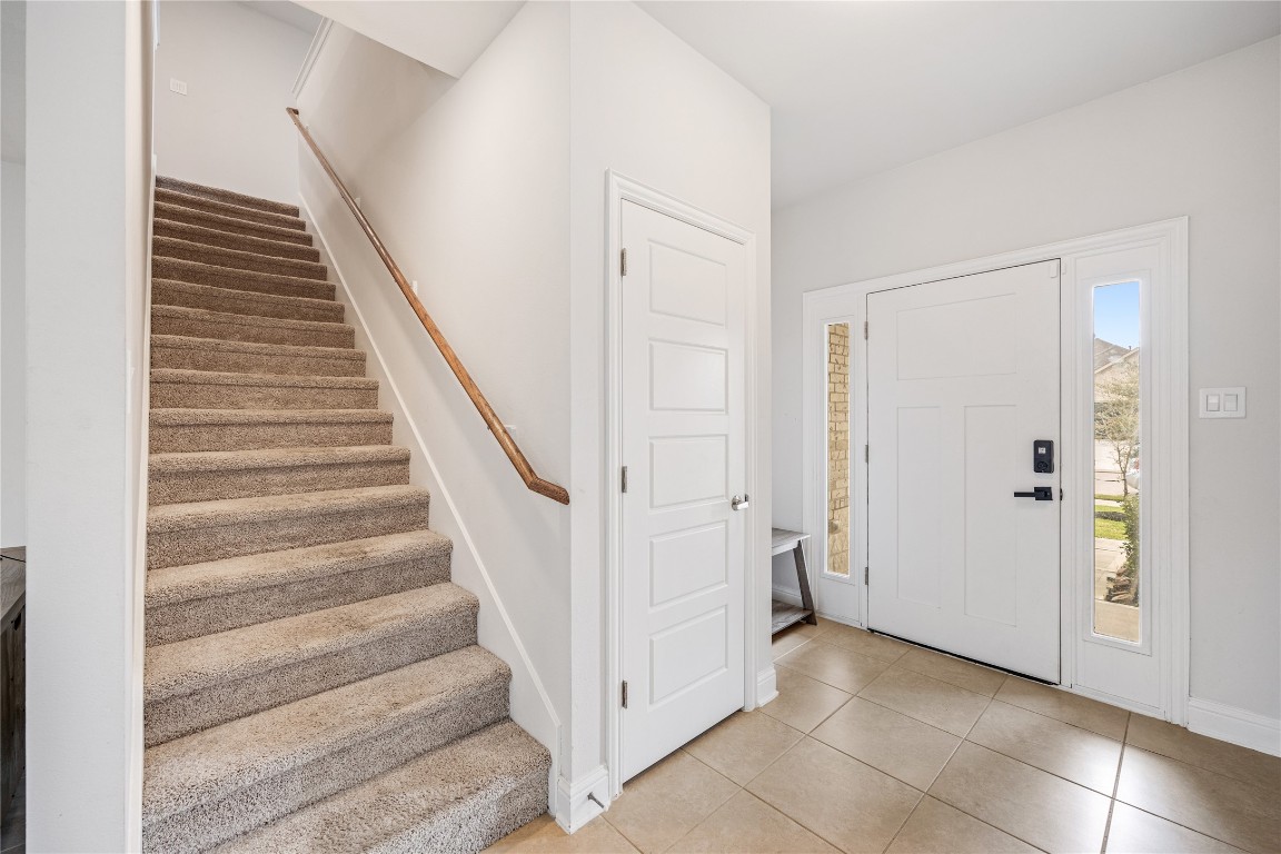 32906 Ruthie Dean Drive Brookshire, TX 77423 - Photo 4 of 23 a view of a hallway with staircase and white door