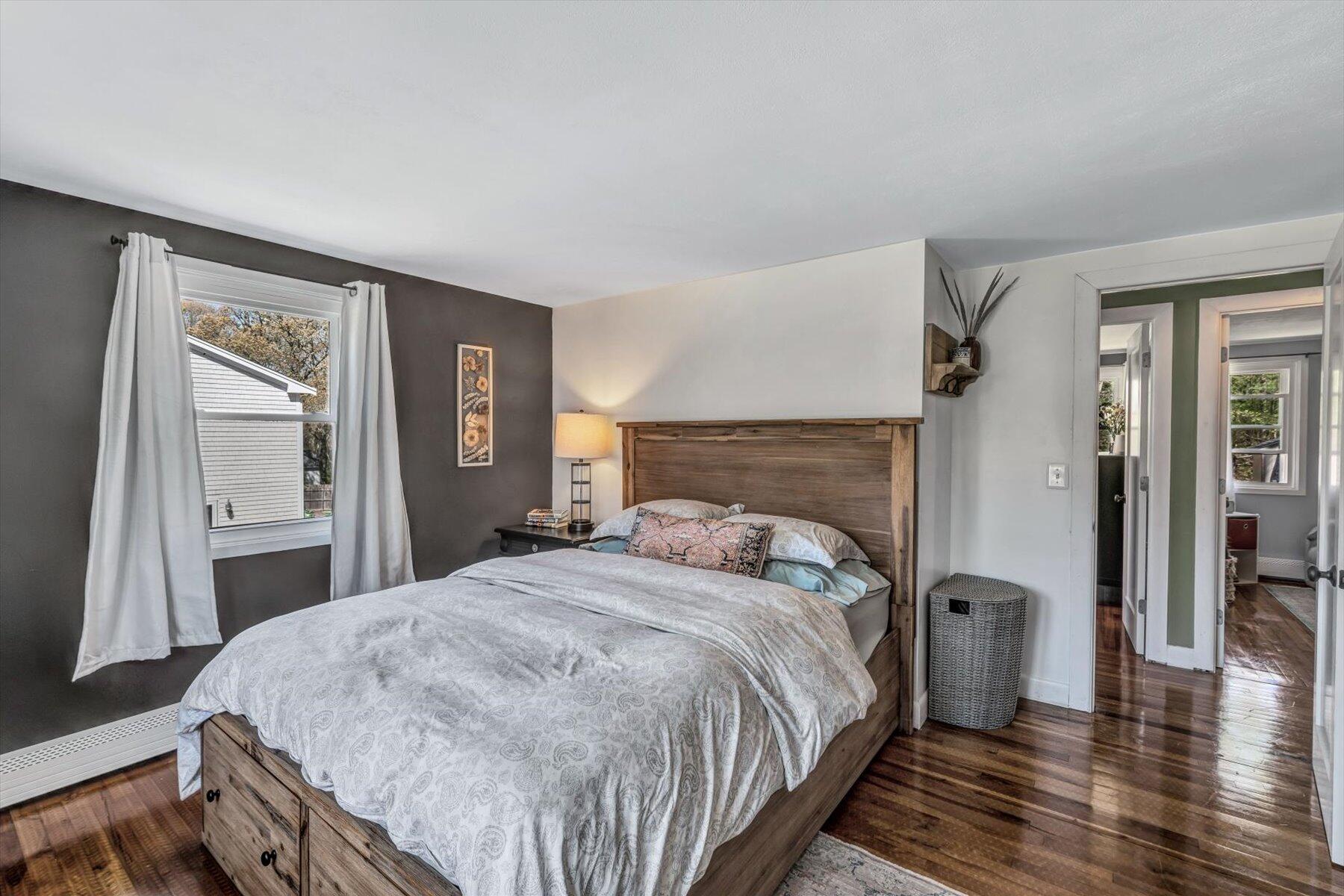 79 Clay Pond Road Monument Beach, MA 02532 - Photo 13 of 46 a bedroom with a bed and wooden floor