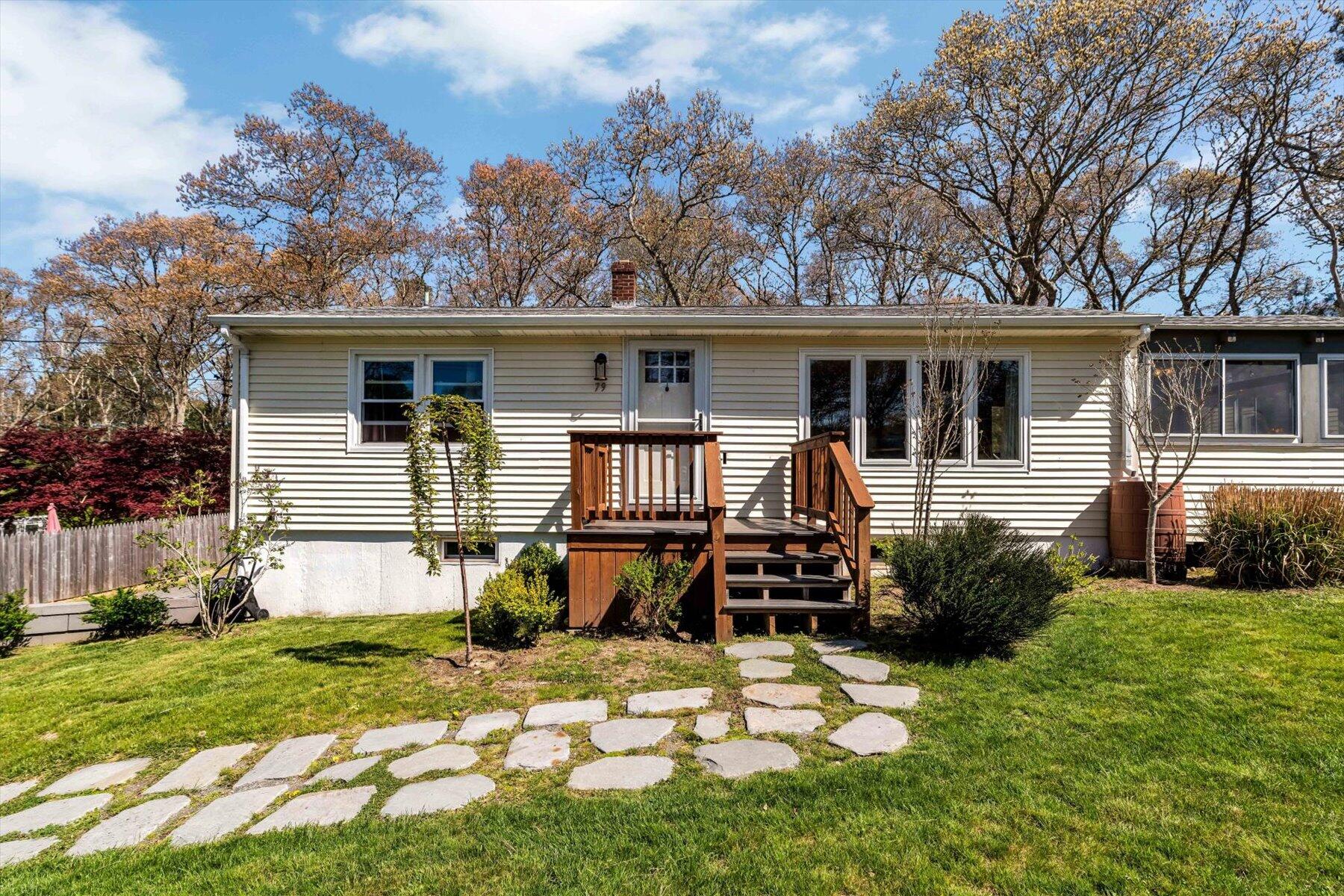 79 Clay Pond Road Monument Beach, MA 02532 - Photo 2 of 46 a house view with a garden space