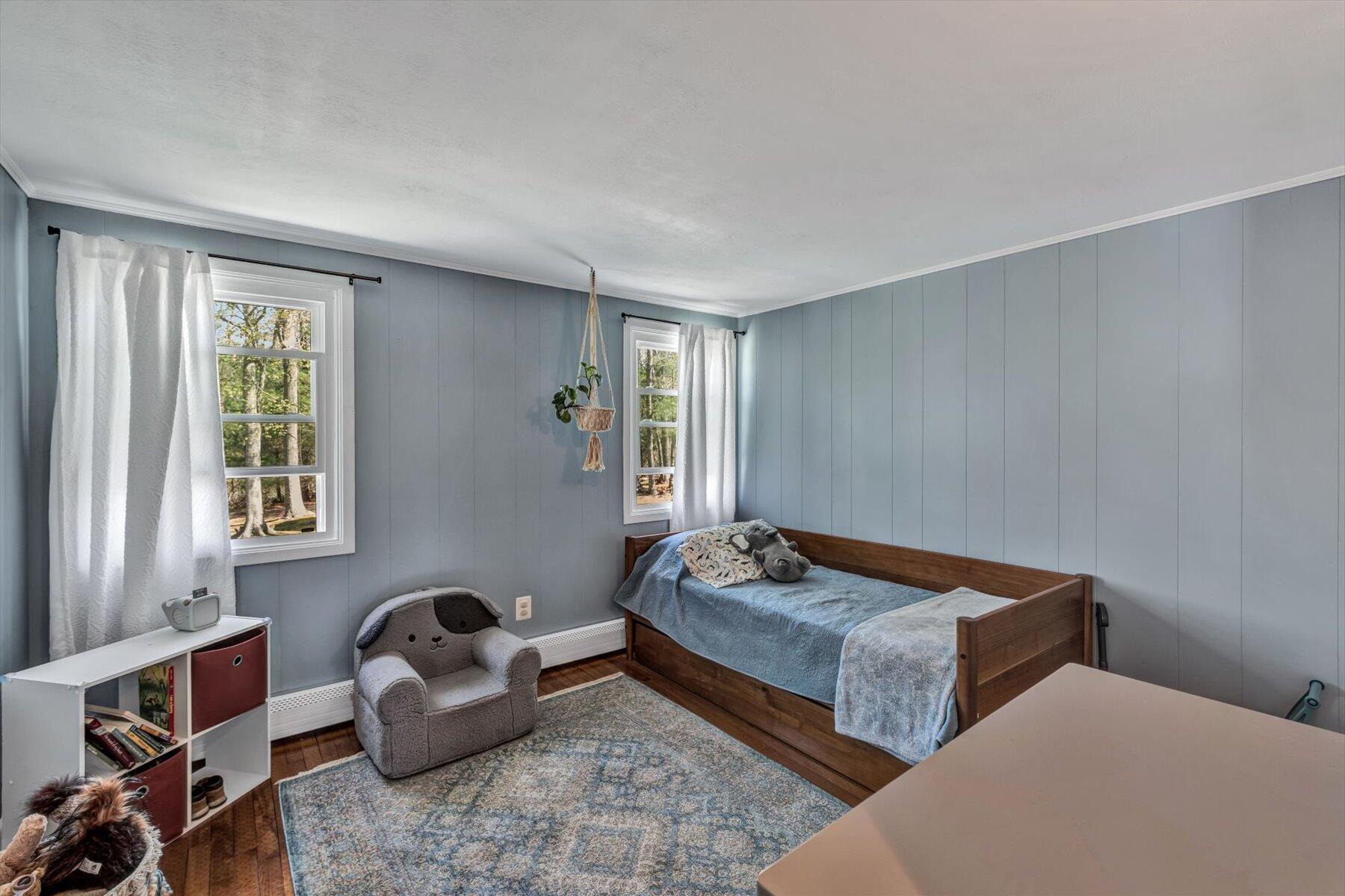 79 Clay Pond Road Monument Beach, MA 02532 - Photo 24 of 46 a bedroom with two beds and a couch